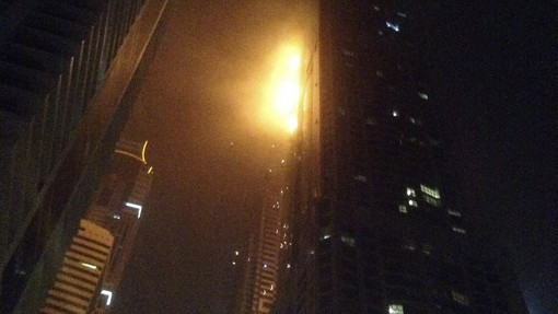 A fire blazes at "The Torch", a residential high-rise tower, in Dubai