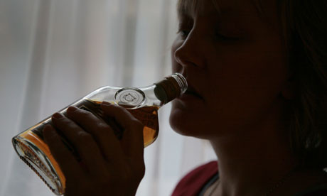 alcoholic woman drinking spirits from bottle. Image shot 2006. Exact date unknown.