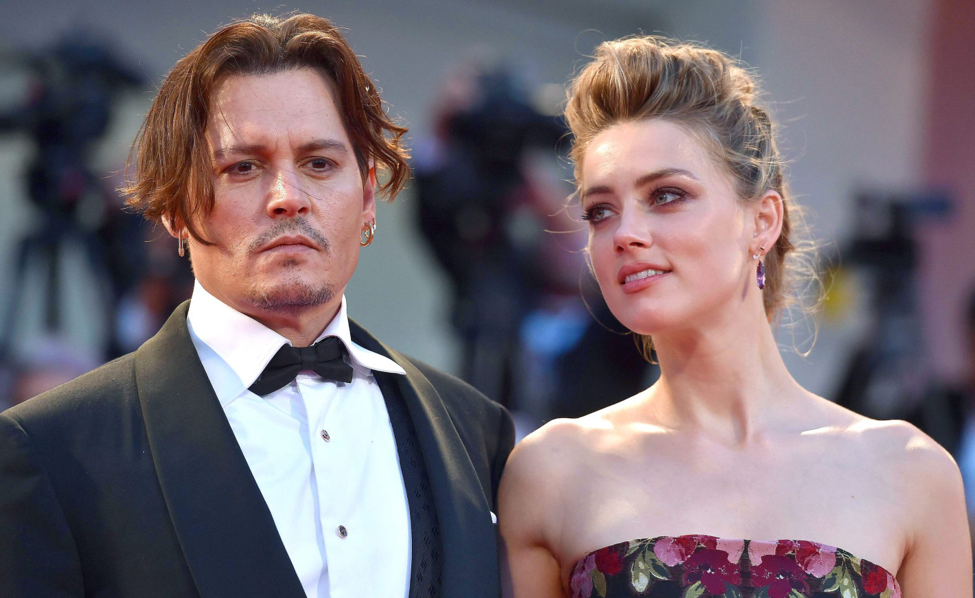 epa04915339 US actress/cast member Amber Heard and her husband Johnny Depp (L) arrive for the premiere of 'The Danish Girl' during the 72nd annual Venice International Film Festival, in Venice, Italy, 05 September 2015. The movie is presented in official competition 'Venezia 72' at the festival running from 02 September to 12 September. EPA/ETTORE FERRARI